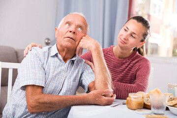 Adult daughter reassures offended father. High quality photo