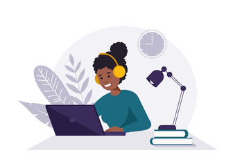 Home office concept, black woman with headphones and laptop working from home, student or freelancer