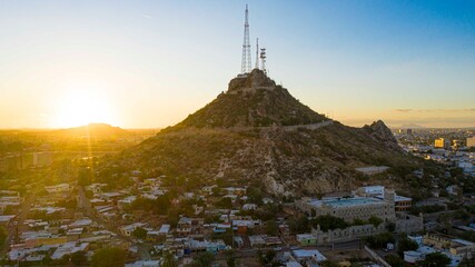 Aerial view of Cerro de la Campana at sunset and the Hacienda de La Flor, Revolucion colonies on December 10, 2020 in Hermosillo, Mexico