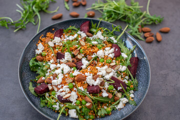 healthy home made couscous salad with sweet potato, beetroot and feta cheese