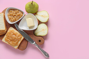 Board with fresh bread, tasty pear jam and butter on color background