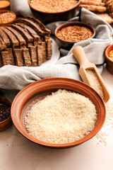Bowl with rice and different products on table, closeup