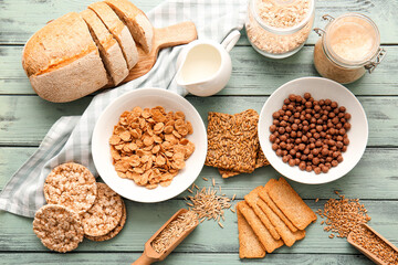 Set of different products on color wooden background