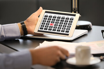 Businessman trying to meet deadline in office