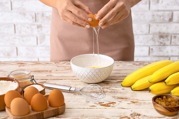 Woman preparing banana cookies in kitchen