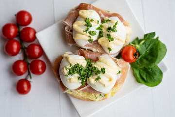 prosciutto dry hure ham with egg mayo dressing open bread sandwich with salad vegetables finger party food 