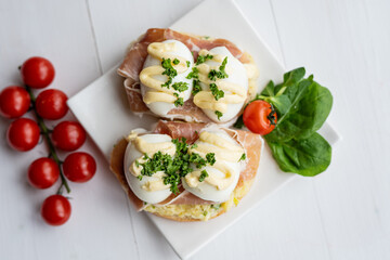 prosciutto dry hure ham with egg mayo dressing open bread sandwich with salad vegetables finger party food 