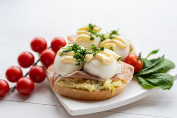 Fototapeta na wymiar prosciutto dry hure ham with egg mayo dressing open bread sandwich with salad vegetables finger party food 