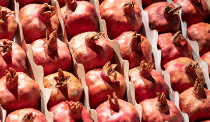 fresh pomegranates on the counter for making fresh juice