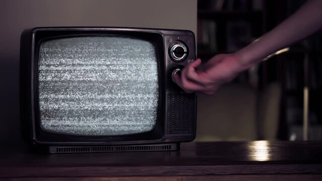 Male Hand Hitting an Old TV Set until Green Screen Appears. You can replace green screen with the footage or picture you want. You can do it with “Keying” effect in After Effects. 4K Resolution.