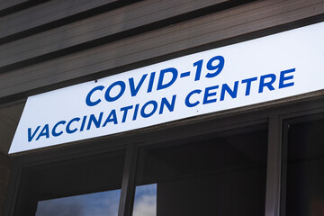 View of entrance building with sign Covid-19 Vaccination Centre in Nanaimo, Canada