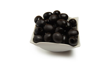 a handful of olives in a saucer isolated on a white background. pizza cooking concept.