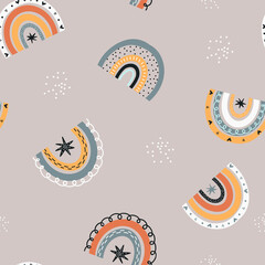 Baby seamless pattern with rainbows.