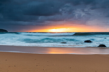 Fototapeta na wymiar A moody overcast sunrise seascape