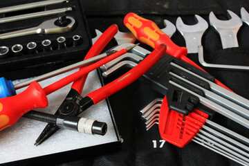 Fototapeta premium The mechanic's locksmith tool lies on the workbench