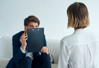 Fototapeta premium business man and woman communication officials office documents