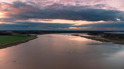 Obraz premium An aerial view at sunset over the River Deben at Ramsholt in Suffolk, UK