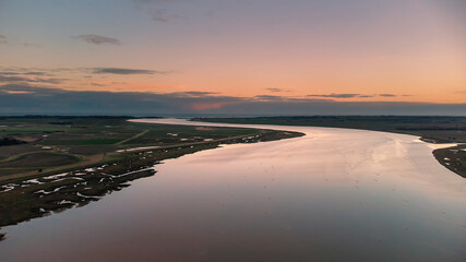 An aerial view at sunset over the River Deben at Ramsholt in Suffolk, UK