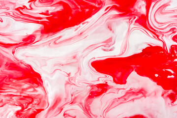 Red and white fluid art, abstract creative background with acrylic paints. Dynamic lines, free movement, outburst of emotions, passion, free natural form. The concept of strawberries with cream.