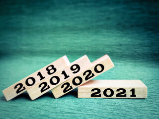 New Year's Concept - 2021 on wooden blocks background. Stock photo.