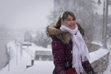 Portrait of a young beautiful girl by the river Nisava in eastern Serbia, on a beautiful snowy day.