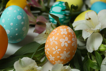 Color Easter eggs and alstroemeria flowers, close up