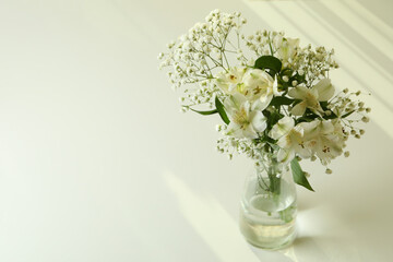 Vase with beautiful alstroemeria and gypsophila flowers