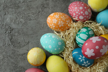 Beautiful multicolor Easter eggs on gray textured background