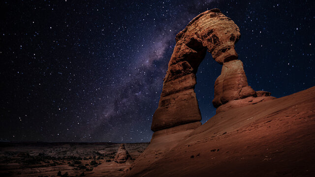 The delicate arch by night with the milky way, utah, arches national park