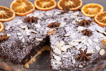 Tart with poppy seeds and fruit sprinkled with powdered sugar