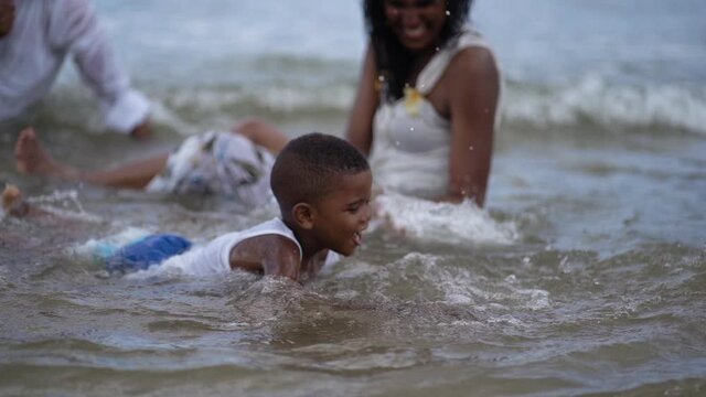 African American boy having fun on the beach