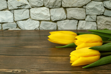 Bouquet of yellow tulips on . Mother's Day, Valentine's Day, Birthday celebration concept. A greeting card. Copy space for text, top view