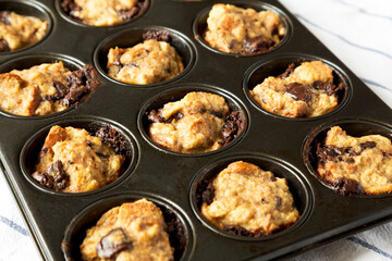 Homemade Chocolate Banana Bread Pudding in a baking dish, low angle view. Close-up.