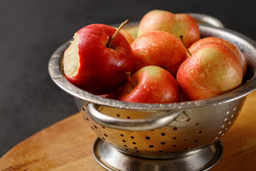 Metallic bowl full of red ripe apples. Healthy eating. Apple pie ingridients. Cooking at home