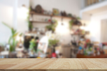 Table top with cafe restaurant background for products display.