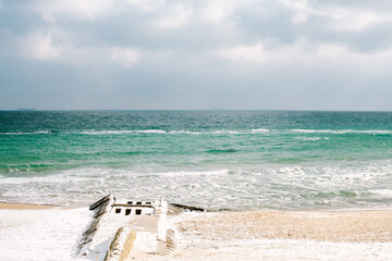 black sea in winter. seagulls fly in the sky