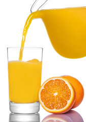 Orange juice pouring from pitcher into glass, isolated on white background