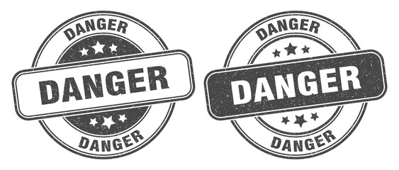 Obraz premium danger stamp. danger label. round grunge sign