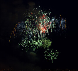 Colorful poster on light fireworks against night sky