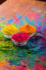 Colorful traditional holi powder in bowls. Happy holi. Concept Indian color festival called Holi. Organic Gulal dust