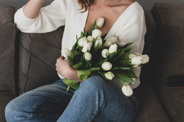 girl sitting with flowers, tulips, congratulations