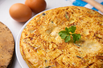 Traditional Spanish omelette with potatoes and zuuchini