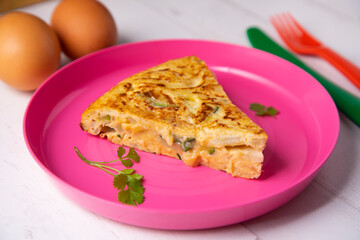 Traditional Spanish omelette with potatoes and zuuchini