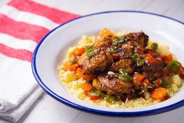 Marinated chicken with vegetables and cuscus