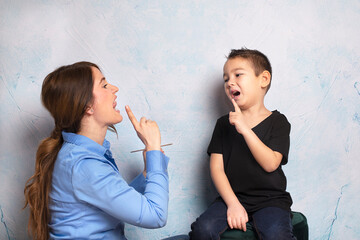 Shot of a speech therapist during a session with a little boy