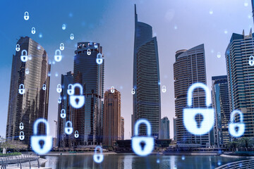 Skyscrapers of Dubai business downtown. International hub of trading and financial services. Lock icon hologram, concept of datum security. Double exposure. Dubai Canal waterfront.