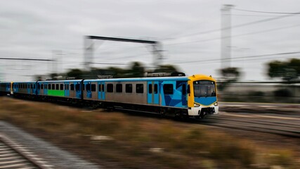 Commuter train approaching a train station in Melbourne Victoria Australia