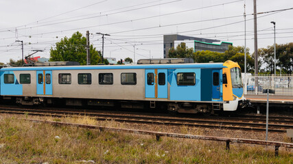 Commuter train approaching a train station in Melbourne Victoria Australia