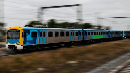 Commuter train approaching a train station in Melbourne Victoria Australia