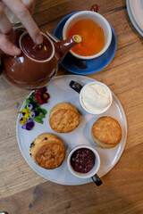 Scones with clotted cream, jam and tea